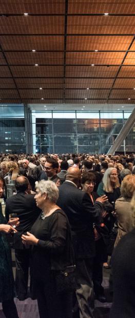 A crowd of people networking at the Boston Convention & Exhibition Center during CHAPA's 50th Annual Dinner